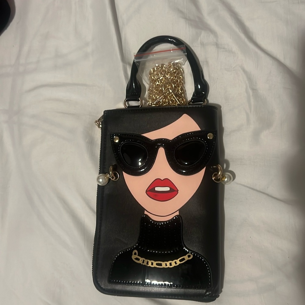 Unique 3D woman's face fashion bag. Black gold colored chain. New with tags